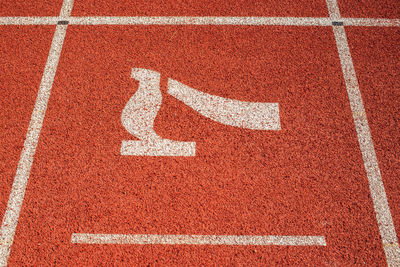 High angle view of arrow sign on wall