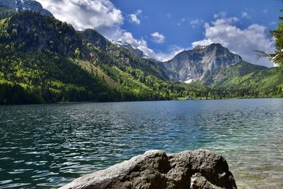 Scenic view of lake and mountains against sky