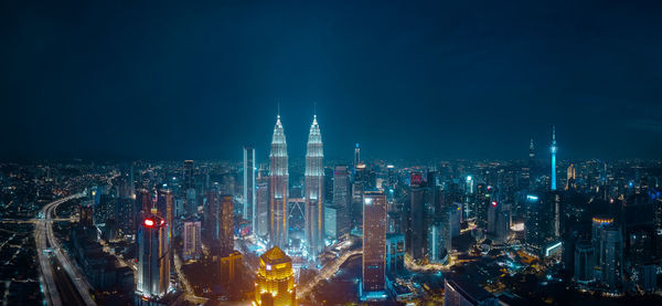 Illuminated buildings in city at night