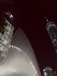 Low angle view of modern building at night