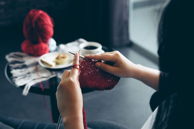 Midsection of woman holding ice cream