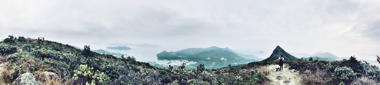 mountain, sky, scenics, tranquil scene, tranquility, beauty in nature, mountain range, cloud - sky, nature, landscape, cloudy, non-urban scene, idyllic, cloud, rock - object, rock formation, physical geography, rocky mountains, geology, remote