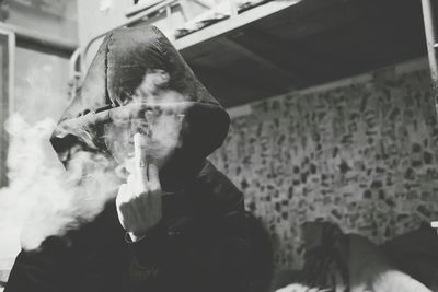 Midsection of woman holding cigarette