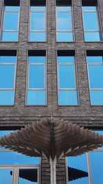 Low angle view of building against blue sky