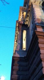 Low angle view of built structure against blue sky