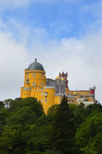 View of historic building against cloudy sky