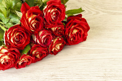 High angle view of rose petals on table