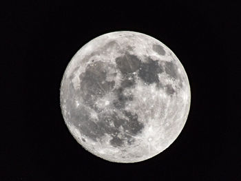 Close-up of moon against clear sky at night