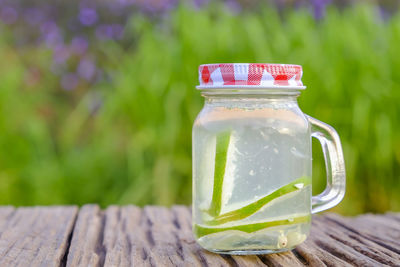 Close-up of drink in glass jar on table