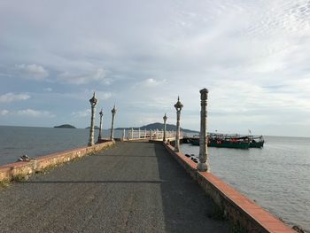 Pier over sea against sky