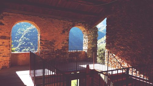 Sunlight through arched window in old building