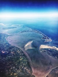 High angle view of sea shore against sky