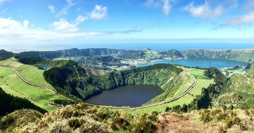 Scenic view of sea and landscape against sky