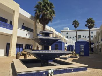 Buildings against blue sky and clouds