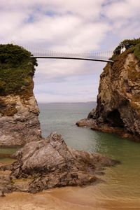 View of suspension bridge over sea