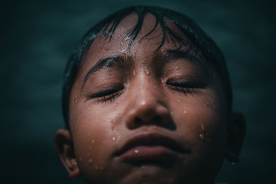 Asian men swimming in lake ranau with mountain views, ranau indonesia.