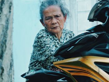 Portrait of woman sitting in car