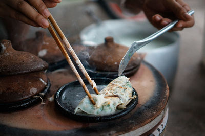 Close-up of person preparing food