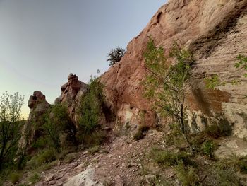 Low angle view of rock formation against sky