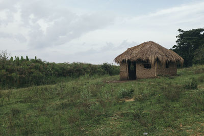 House on landscape against sky