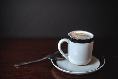 Close-up of coffee cup on table