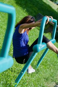 Rear view of woman on grassy field