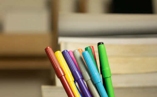 Close-up of multi colored pencils on table