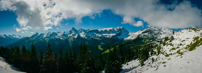 Panoramic shot of snowcapped mountains against sky