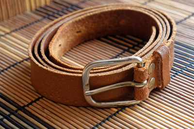 Close-up of belt on place mat