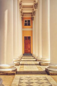 Corridor to door with architectural columns