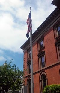 Low angle view of flag against sky