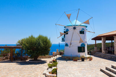 Traditional windmill against blue sky