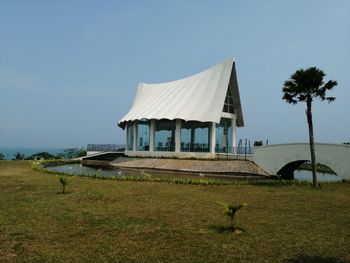 Built structure on field against sky