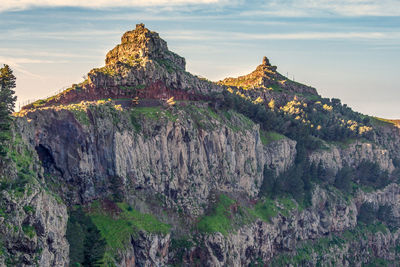 Panoramic view of rock formations against sky