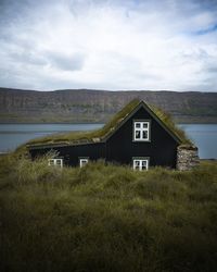 House on field against sky