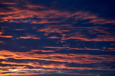 Low angle view of dramatic sky during sunset