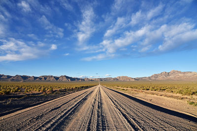 Scenic view of landscape against blue sky