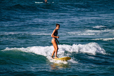 Side view of man in sea
