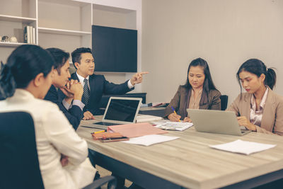 Business colleagues working in office