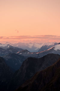 Scenic view of mountains against sky during sunset