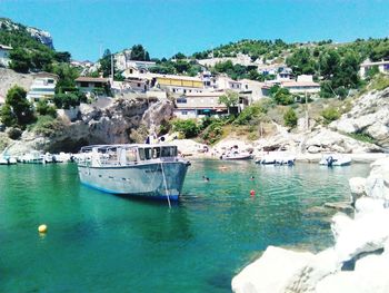 Calm sea with town in background