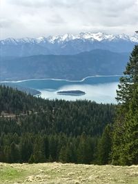 Scenic view of lake and mountains against sky