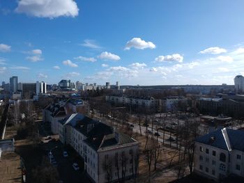 High angle view of buildings in city against sky