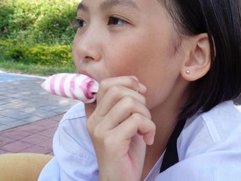 Portrait of girl holding ice cream