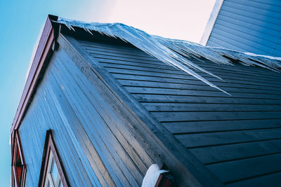 Low angle view of building against clear blue sky