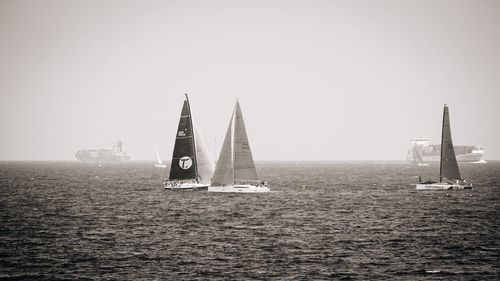 Boats sailing in sea