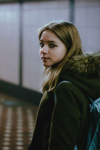 Portrait of a young woman looking down