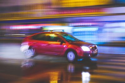 Blurred motion of car on street at night