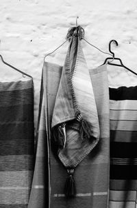 Close-up of clothes hanging on floor