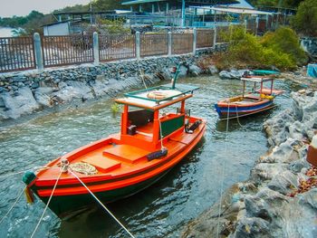 Boat moored on river